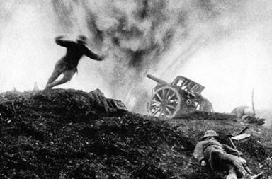 German soldier dives for cover as shell explodes behind him at an artillery position, 1917