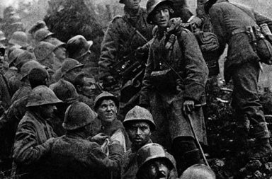 Captured Italian soldiers are escorted to the rear by German soldiers during the Battle of Caporetto, 1917