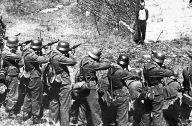 Georges Blind, a member of the French resistance, smiling at a German firing squad, 1944