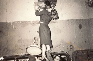 Actress Marlene Dietrich kisses a soldier returning home from war, 1945