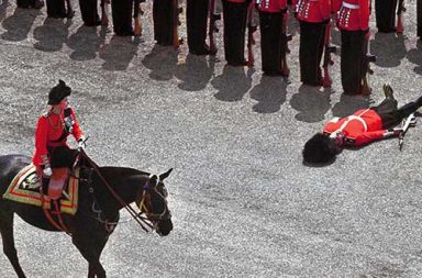 A guard of honor passes out as Queen Elizabeth II rides past during the trooping the color parade, 1970