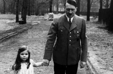 Adolf Hitler on a walk with Helga Goebbels, 1936