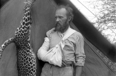 Taxidermist Carl Akeley posing with the leopard he killed with his bare hands after it attacked him, 1896